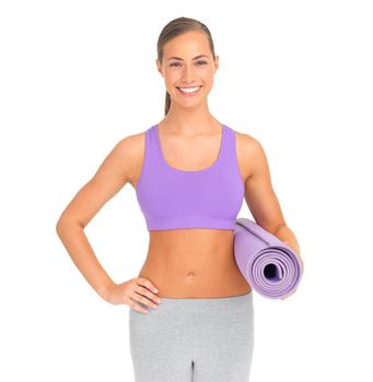 Shes ready for a workout. Studio portrait of a sporty young woman holding an exercise mat against a white background