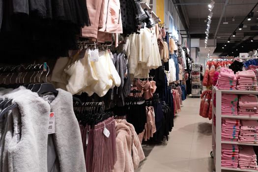 interior of a boutique selling fashionable clothes for children and adults