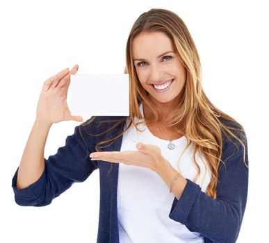 Proud to introduce...Studio shot of a young woman carrying a blank placard isolated on white.