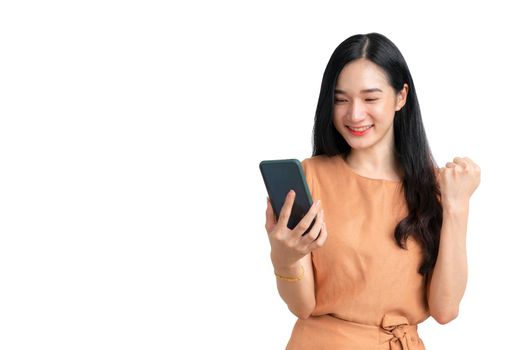 Beautiful Asian woman holding smartphone for business online.  Success business