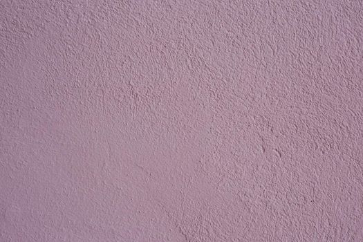 Beautiful purple textured stucco on the wall.