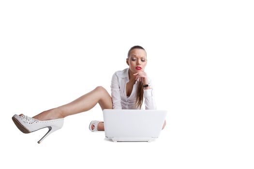 sexy confused woman sit with laptop and long legs
