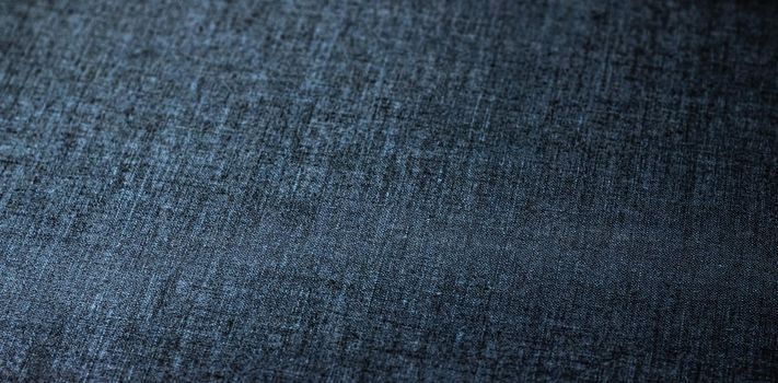 Decorative linen blue jeans fabric textured background for interior, furniture design and fashion label backdrop