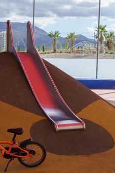 slide and bicycle in a playground