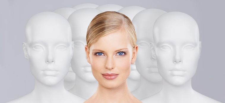 Bring your beauty to life. A young woman standing amongst a group of mannequins.