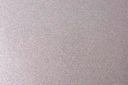 Silver, shiny and glittering surface. Abstract background. Events, celebrations. Trendy backdrop for your design. Texture with glitter.