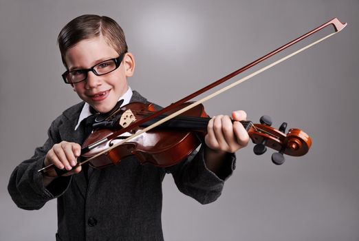 Hes a virtuoso. Studio shot of a young musician dressed in a suit.