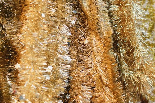 Golden tinsel for decorating the Christmas tree