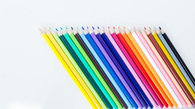Colored pencil crayons in a row