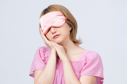 woman with eye mask sleeping