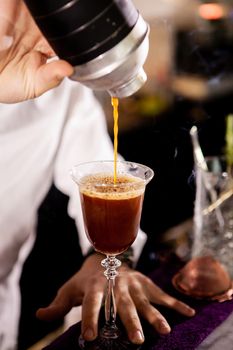 Barman making alcohol coffe drink