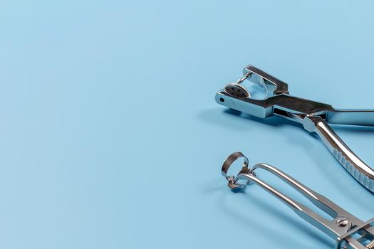 Dental hole punch, metal clamp and rubber dam forceps