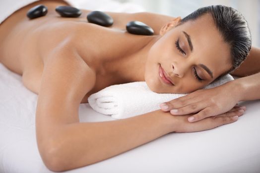Keep calm and spa on. a beautiful young woman relaxing during spa treatment