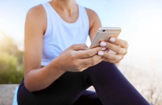 Relax, fitness and social media mobile girl connection with 5g technology typing on screen. Workout woman on smartphone for outdoor rest break with internet app connectivity in nature.