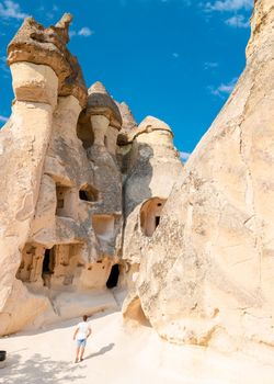 happy young men on vacation in Turkey Cappadocia, Rock Formations in Pasabag Monks Valley, Cappadocia, Turkey
