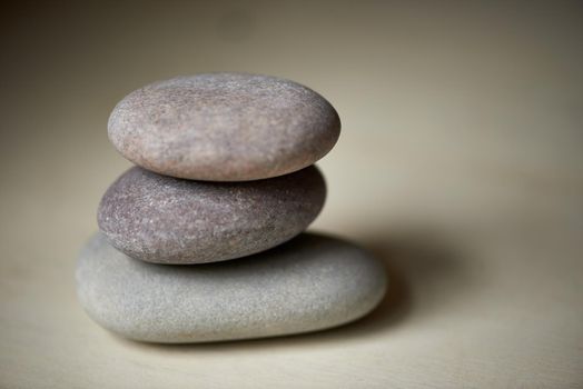 Feeling balanced. Three stones balanced on top of each other in natural light.