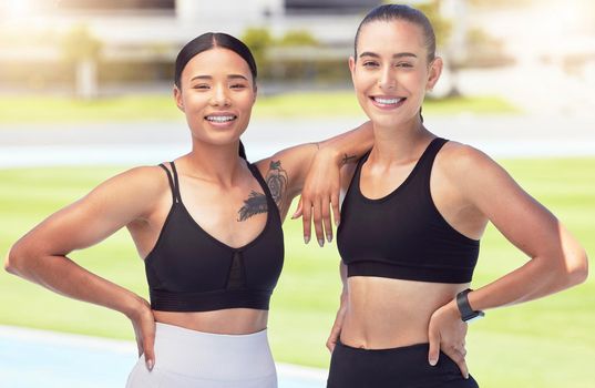 Athlete fitness, workout and exercise friends outdoor on a sports track, stadium or arena with healthy body. Women with smile and happy after cardio training and looking strong, wellness and slim
