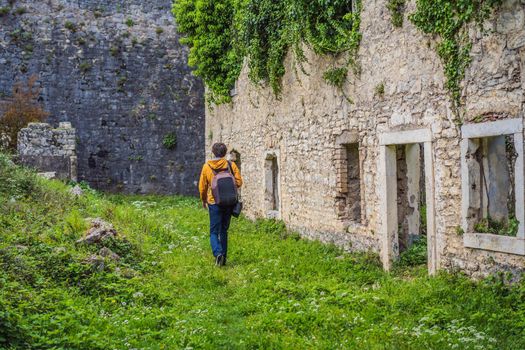 The man in Ruins and stone buildings of the old SPANJOLA fortress in Herceg Novi Montenegro