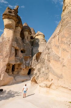 happy young men on vacation in Turkey Cappadocia, Rock Formations in Pasabag Monks Valley, Cappadocia, Turkey
