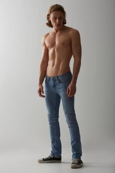 Handsome and stylish. Studio shot of a young man with a bare chest.