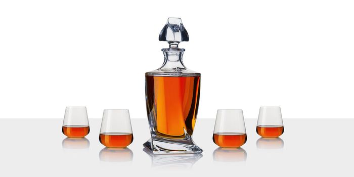 Decanter with cognac. Whiskey decanter on white background.