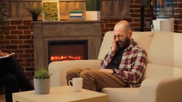 Displeased man complaining about conflict with wife