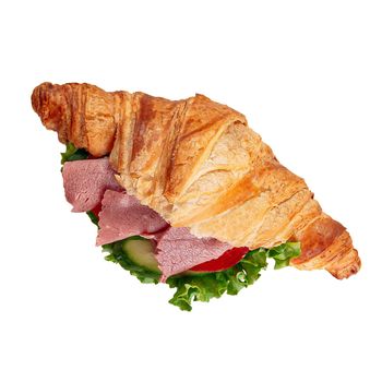 Ham croissant sandwich with tomato and cucumber
