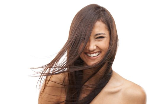 Super sleek and silky. A young woman with shiny hair against a white background.
