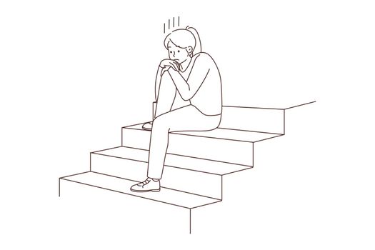Unhappy woman sit on stairs suffer from loneliness