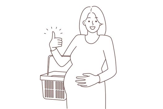Happy pregnant woman shopping with basket