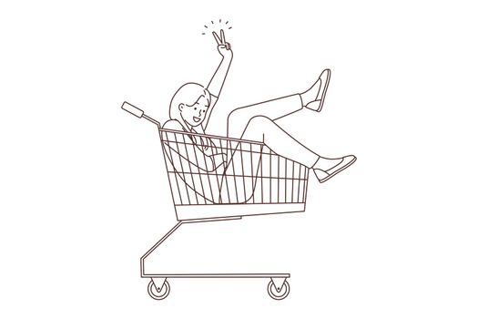 Smiling woman riding in supermarket cart