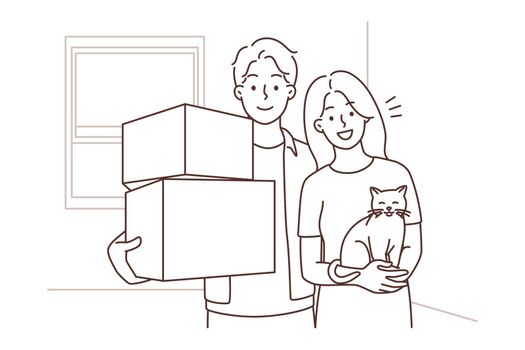 Happy couple with cat on moving day