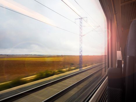 Landscape seen from a window train in motion
