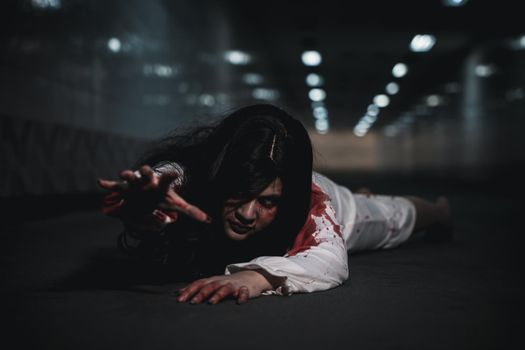Asian woman zombie with blood creepy crawling move slowly creeping out