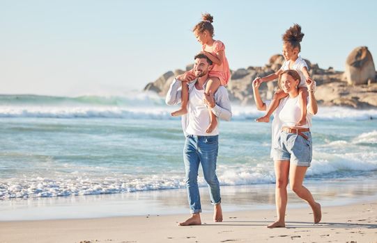 Ocean, piggy back and couple with kids on a summer holiday at the beach. Love, family and fun, man and woman walking with children in sea sand. Vacation, time together and nature, happy in sunshine.