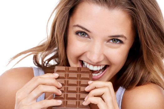 I cant only have one bite. An attractive young woman eating a slab of chocolate.
