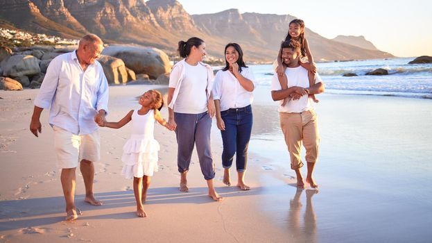 Generation big family walking beach in summer vacation, travel and freedom in South Africa. Happy, smile and carefree grandparents, parents and kids relax, bond and enjoy funny sunny holiday together