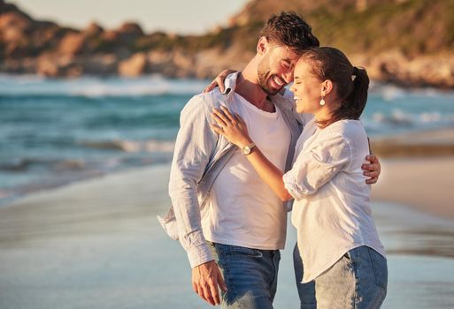 Travel, tourism and beach vacation with happy couple sharing hug, love and laughing while on holiday by the seaside. French man and woman enjoying exotic honeymoon having fun at tropical destination