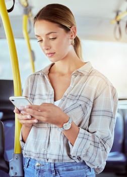 Travel, smartphone and woman on a bus or public transportation reading social media, online news or city website information. Young person with 5g cellphone on train with lens flare for contact us.