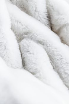 Luxury white fur coat texture background, artificial fabric detail