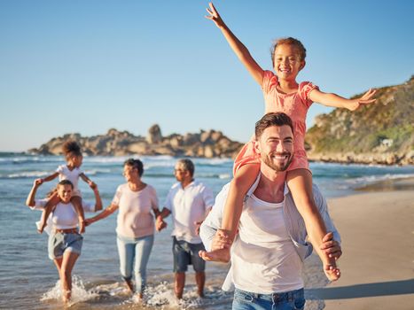 Happy, travel and love with big family at beach for Colombia holiday for summer, relax and support. Sunset, nature and smile with parents, kids and grandparents walking by the sea for vacation.