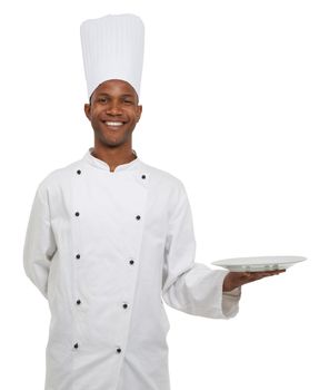 You decide what food goes on this plate. A happy african chef bringing you your food - Copyspace.