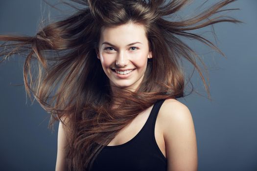 Billowing hair. A beautiful young woman with hair blowing in the wind.