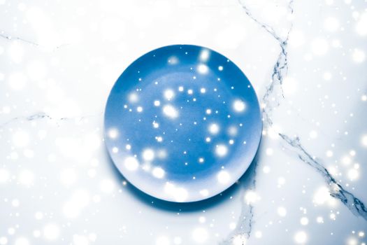 Blue empty plate on marble table flatlay background, tableware decoration for holiday dinner in Christmas time