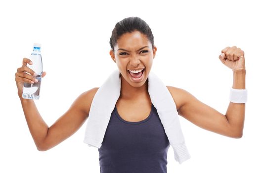 Showing off her strength - Health and Fitness. A young woman holding a bottle of water and flexing her biceps after an energizing workout.