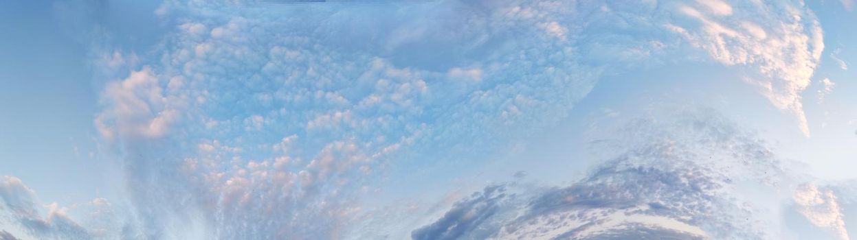 horizontal blue sky panorama with pink clouds for atmospheric background