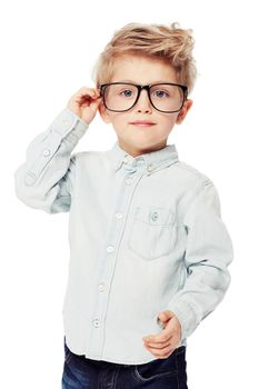 Say what. A sweet little boy wearing glasses touching his ear.
