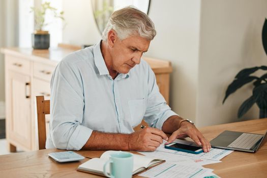 Man, elderly and phone for tax or budget banking with paper at home. Senior, laptop and paperwork with calculator on desk use web for planning, savings and financial compliance in South Africa