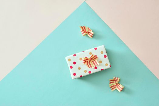 Gift box with ribbon and bow on color background