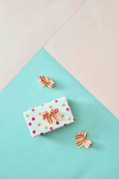 Stylish and beautiful gift box on pastel background.